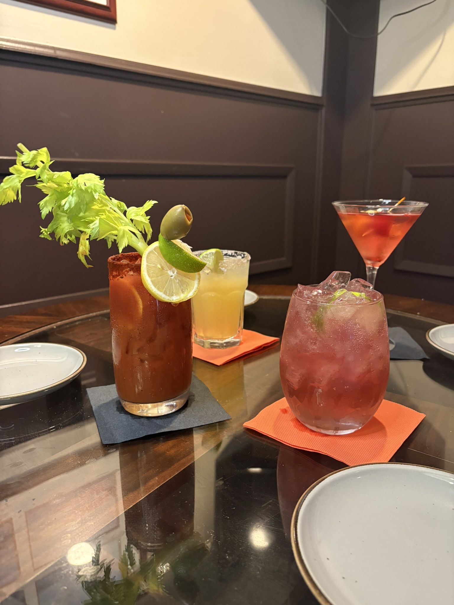 Various drinks sitting on a table in the restaurant